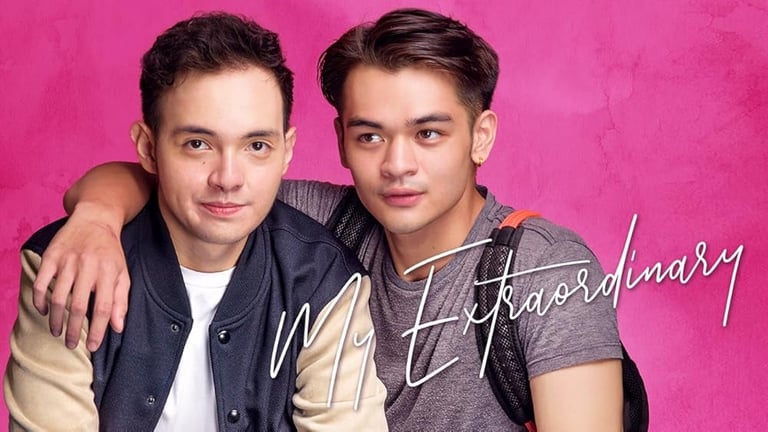 Two young men posing together against a pink background with text reading Extraordinary